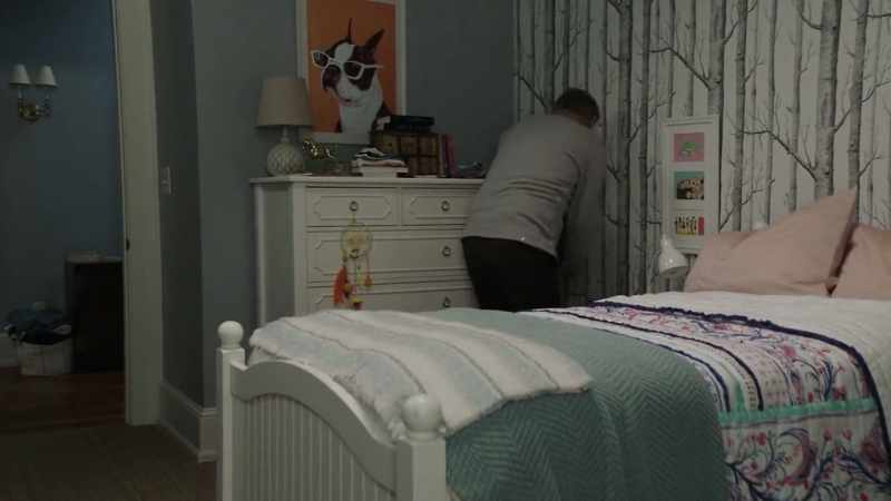 Found it! Behind the pillow