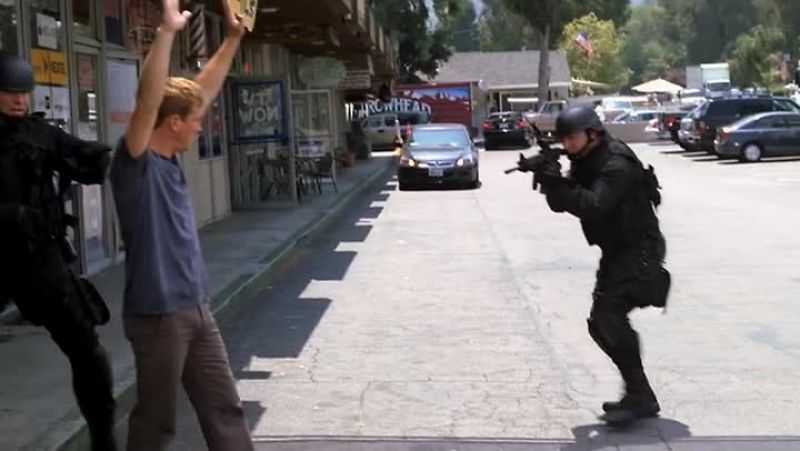 Gary, put your hands up where I can see 'em. Don't move!