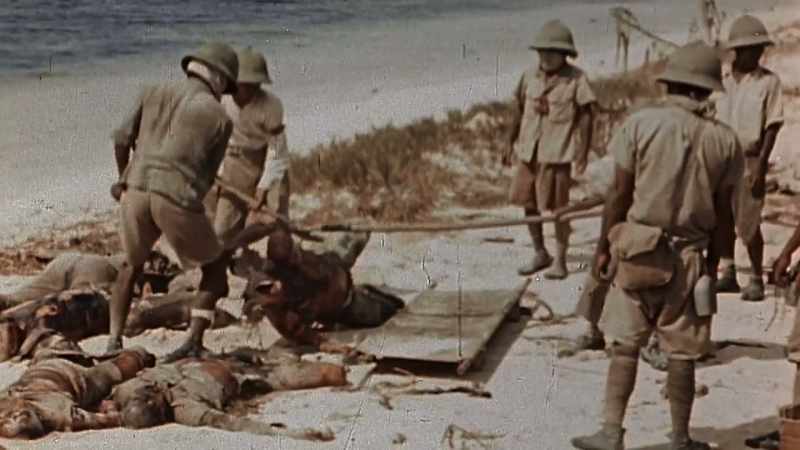 GATHER THEIR OWN WAR DEAD FOR PIT BURIAL
