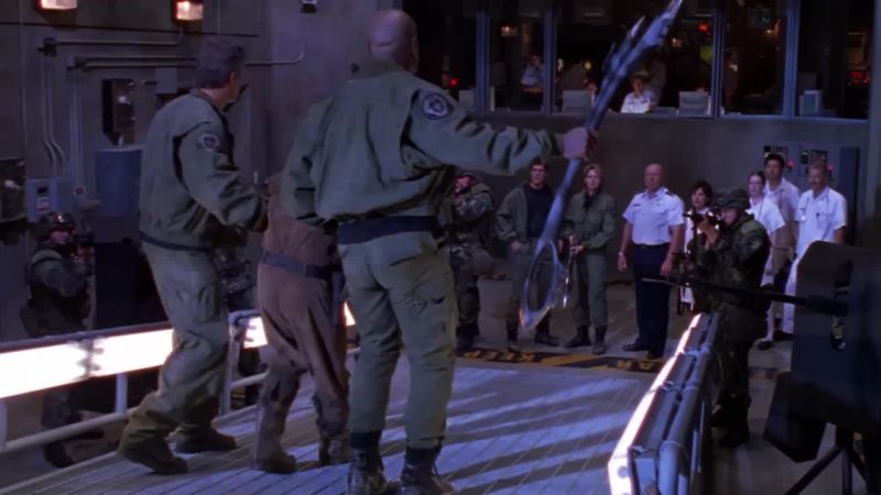 General Hammond, he's a friend. - Stand down!