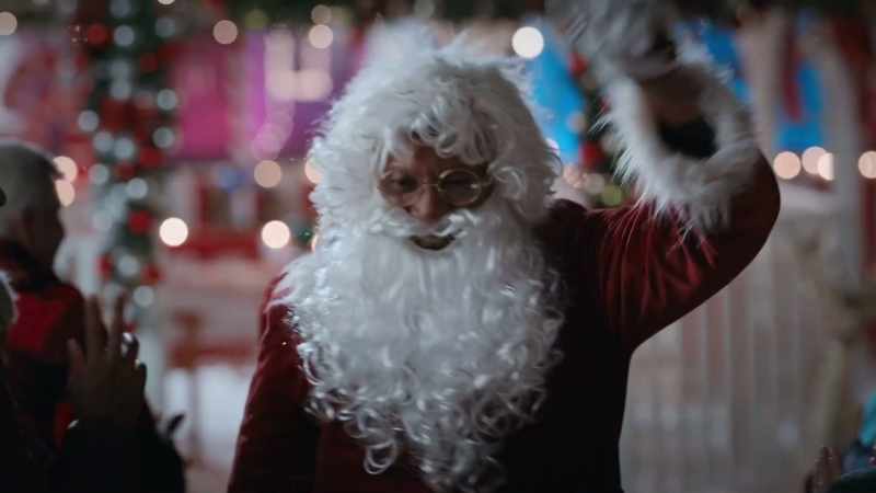 Get your photo with Santa. Single file, right behind me