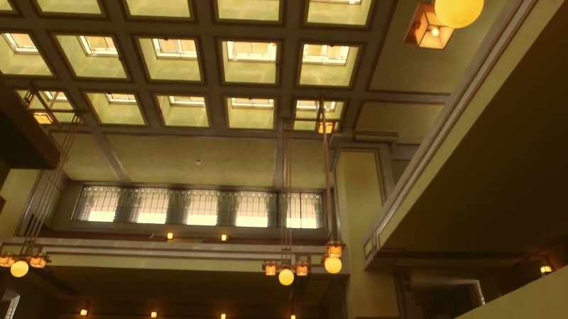 Golden light streams in through coloured glass