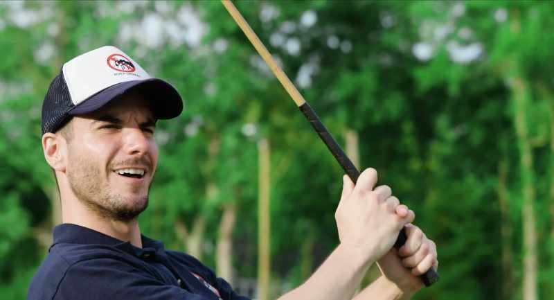 (golf ball whistles)