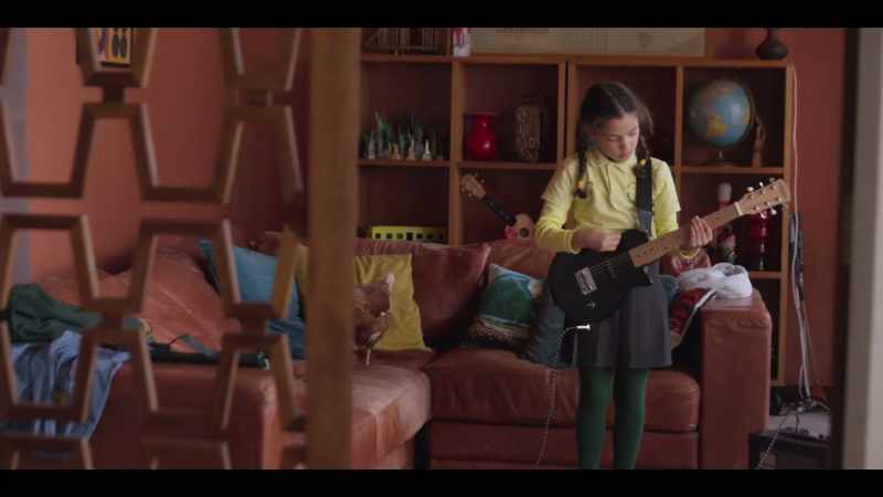 [guitar strums loudly]