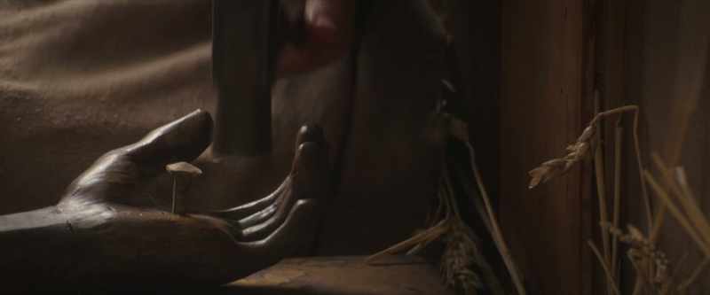 [hammer hits nail and reverberates]