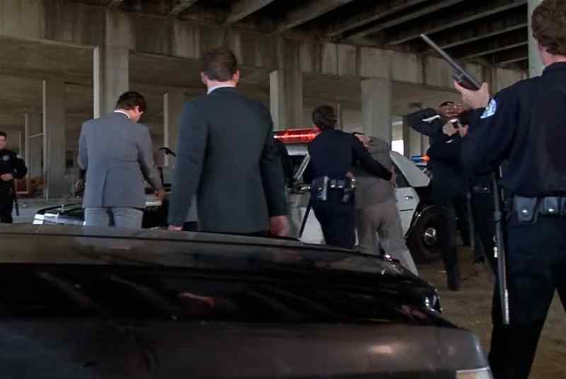 Hands on the car! All right, spread them! Come on