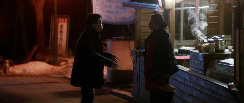 Have you seen a woman wearing a red coat?