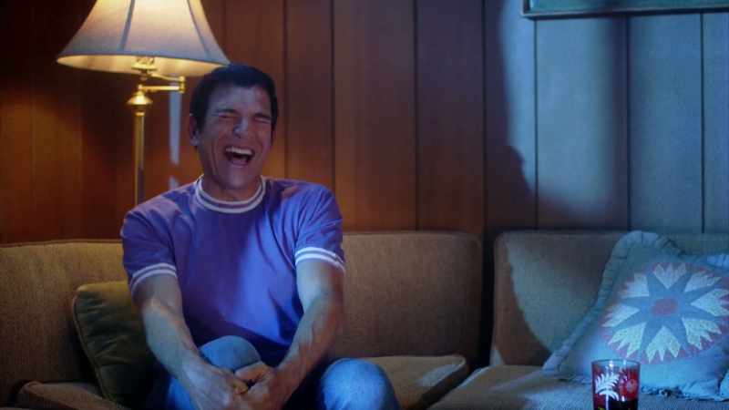 He begins to laugh uncontrollably to the point