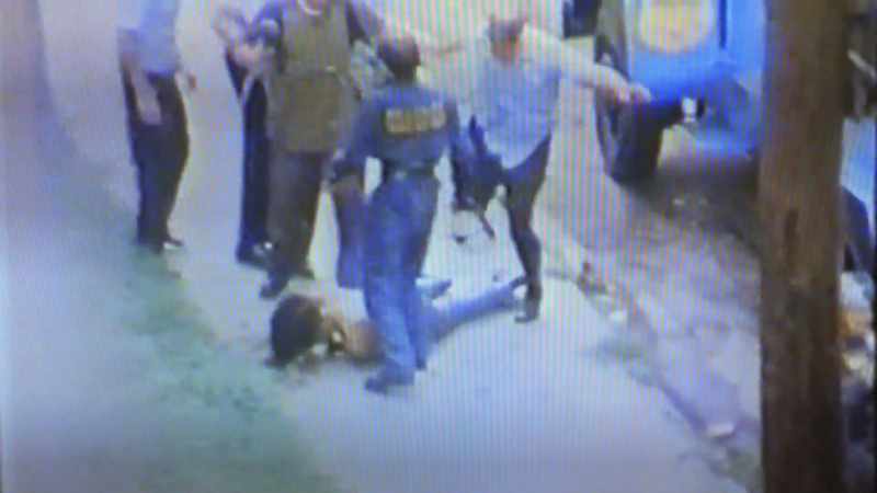 He was being helped out by them three officers