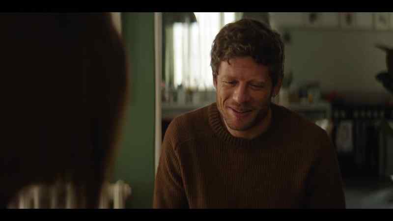 HE CHUCKLES SOFTLY