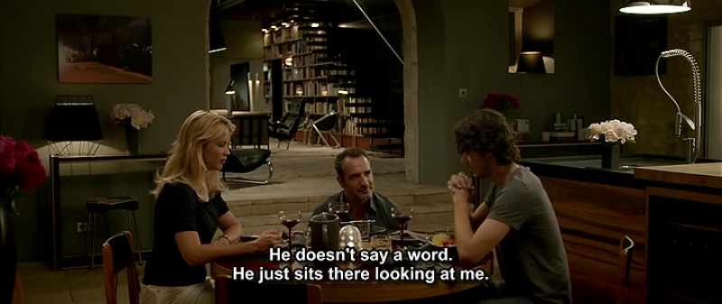 He doesn't say a word. He just sits there looking at me