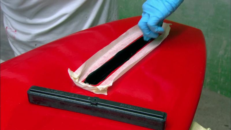 HE FILLS THE HOLE WITH BLACK RESIN