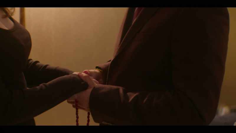 He greets her with two hands, like he's an Arab prince