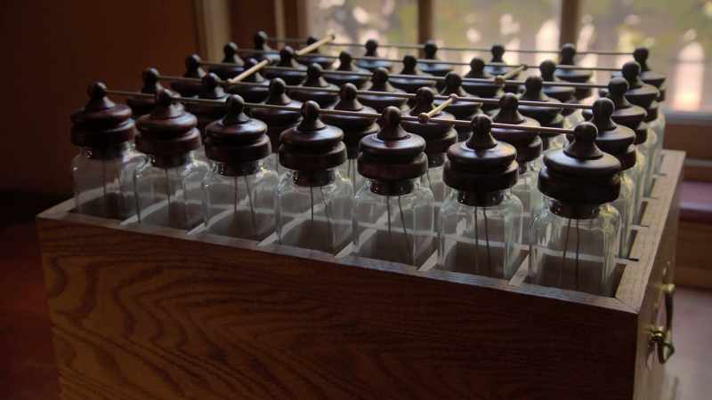 He grouped a collection of glass containers together