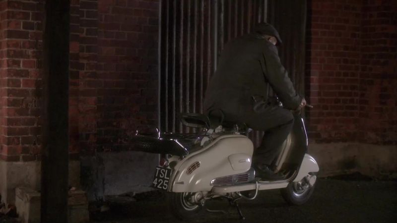 HE MIMICS MOTORBIKE REVVING