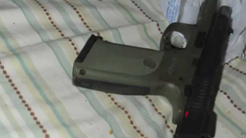 He pulls out a Ruger 9 millimeter