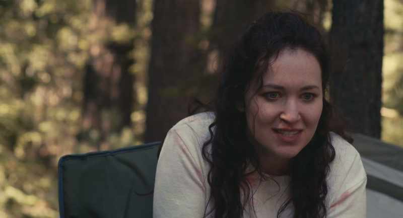 He puts her bloody corpse in the passenger seat and