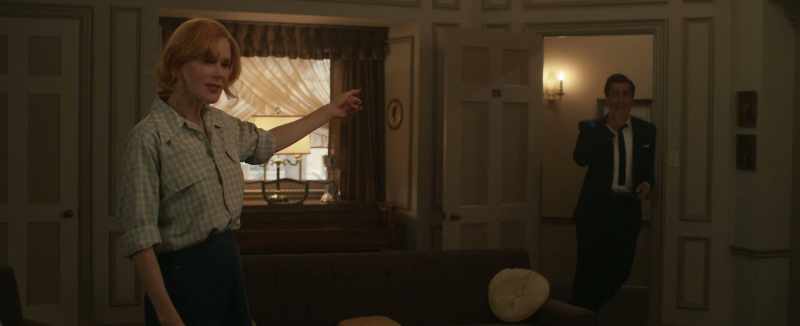 He puts his hands over her eyes and says…