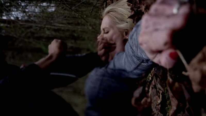 HE PUTS HIS HAND OVER HER MOUTH SO SHE CANNOT SCREAM