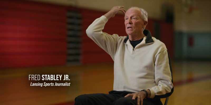 He throws it over his head about three-quarters court down the floor
