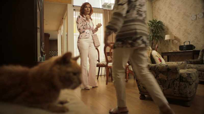 Heels off, before you stand on the poor cat with your lethal weapons