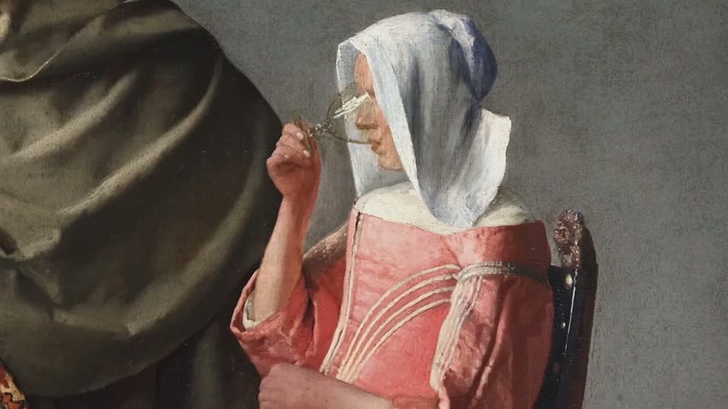 Her face is framed by a clean, white hat