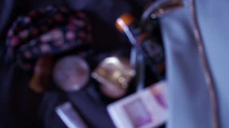 Her purse was scattered on the bed