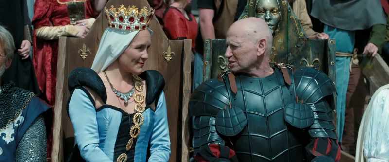 [Heraldic fanfare continuing] [Crowd chattering]