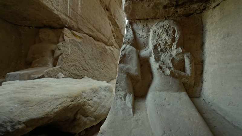 Here, a statue of three seated figures