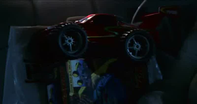 Here. Hide it in the toy car. We'll slip it right past airport security