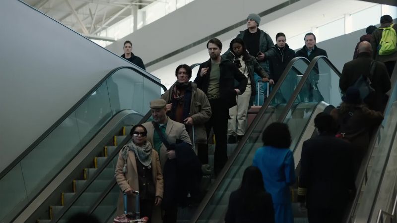 He's coming down the escalator