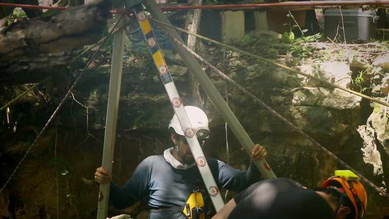 He's exploring the caves surrounding Chichen Itza