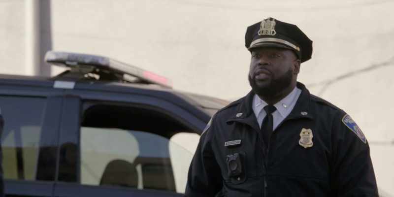 He's fighting a suspect for a gun in his right hand