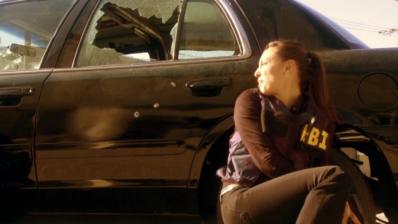He's firing right through the car!
