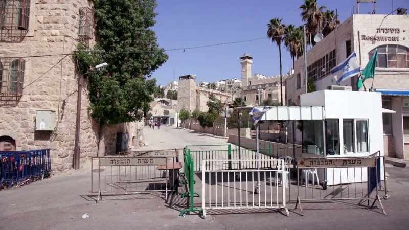He's leading a tour of Hebron