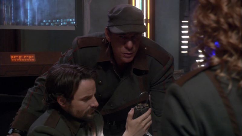 He's stopped. He's not at the control panel. He's looking around