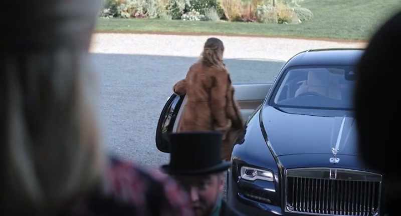 Hey, don't you touch the Rolls-Royce. -[carol singers continue]