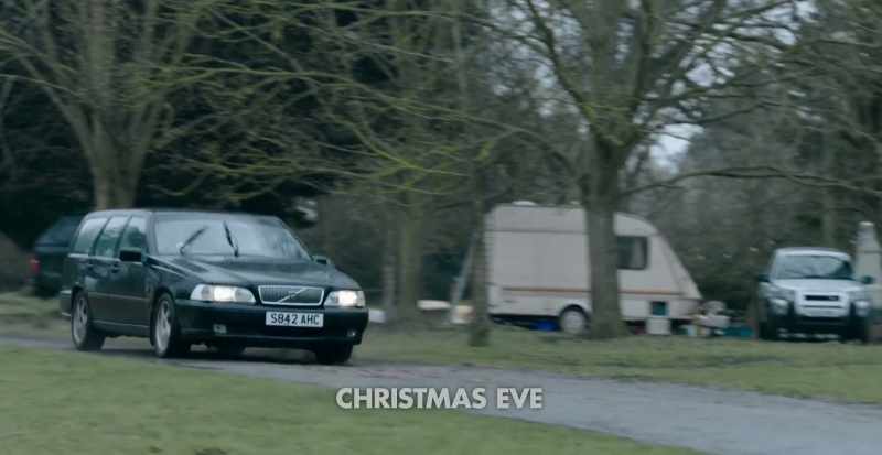 [Holiday music plays]