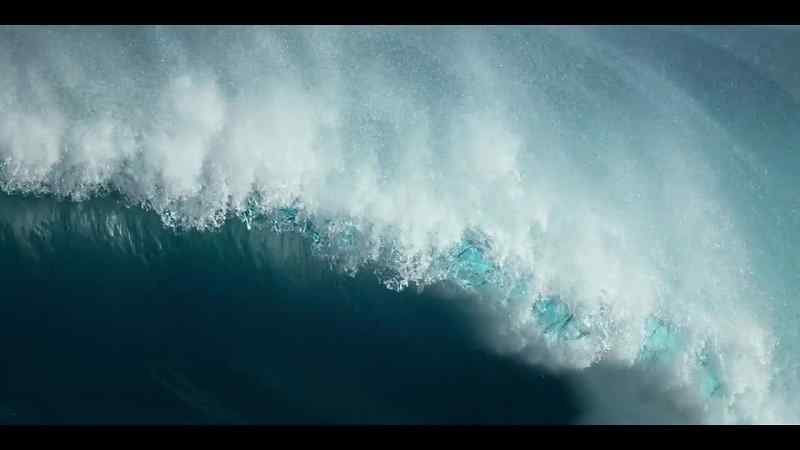 Huge swells, driven by winds, break on the shallows