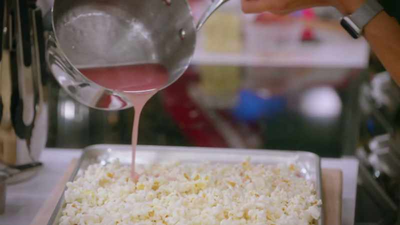 I am pouring on corn syrup, butter, and sugar