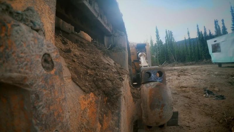 Bolts removed, Fred reverses the dozer