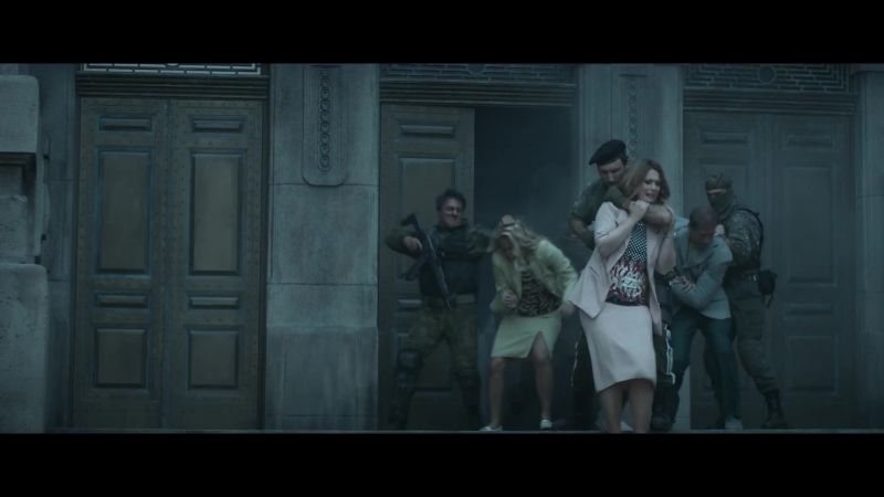[in Russian] Drop your weapons. Or she will die