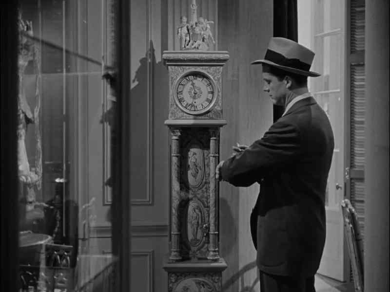 I noted that his attention was fixed upon my clock
