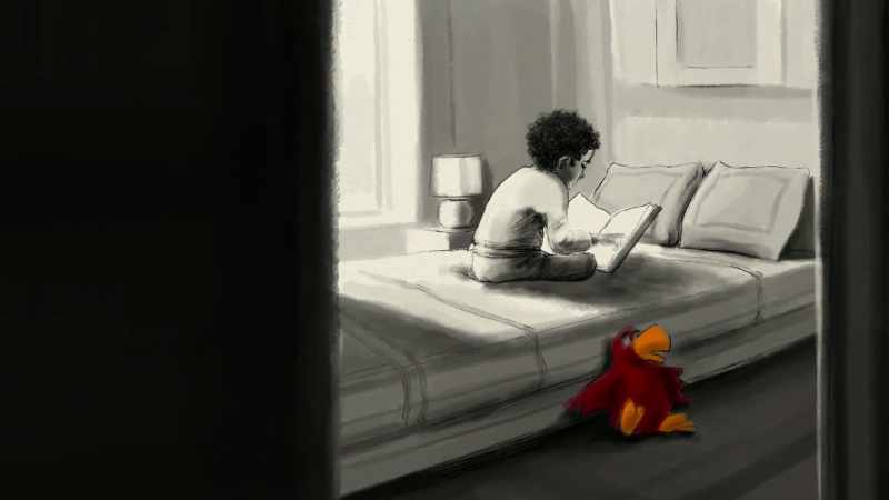 I see Owen on the bed, flipping through a Disney book