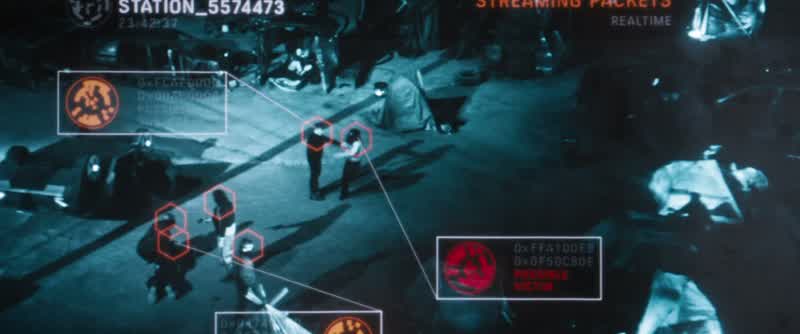 The man who took Asha's purse in the left of frame, there is a marking on his wrist