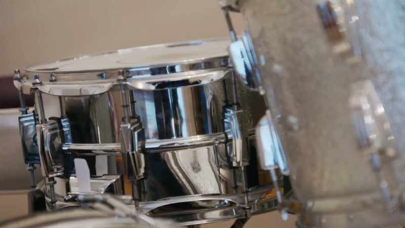 I turn left, I see a five piece drum kit