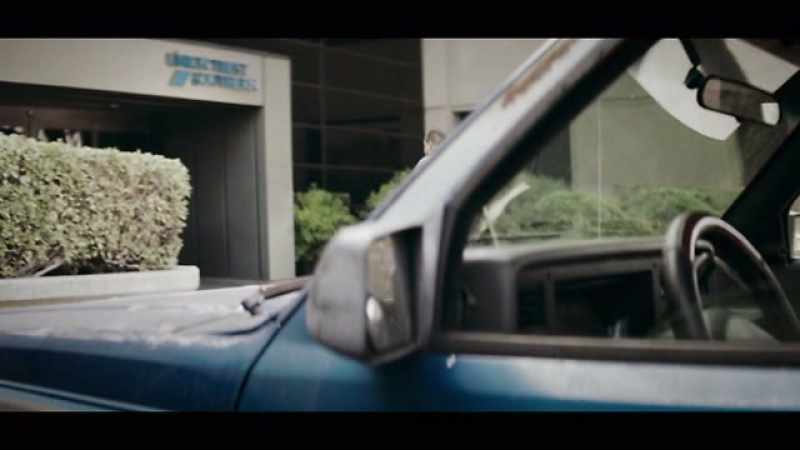 I'm in his car, and we're going to this bank