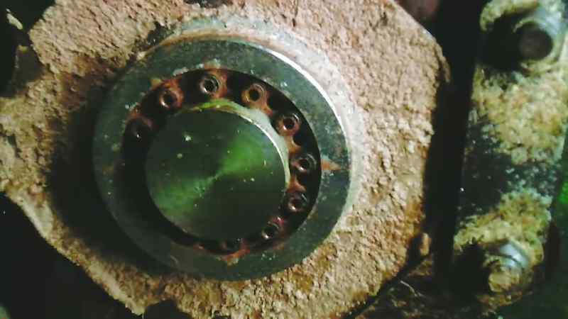 I'm sat on this cage with machinery, and cogs, and chains