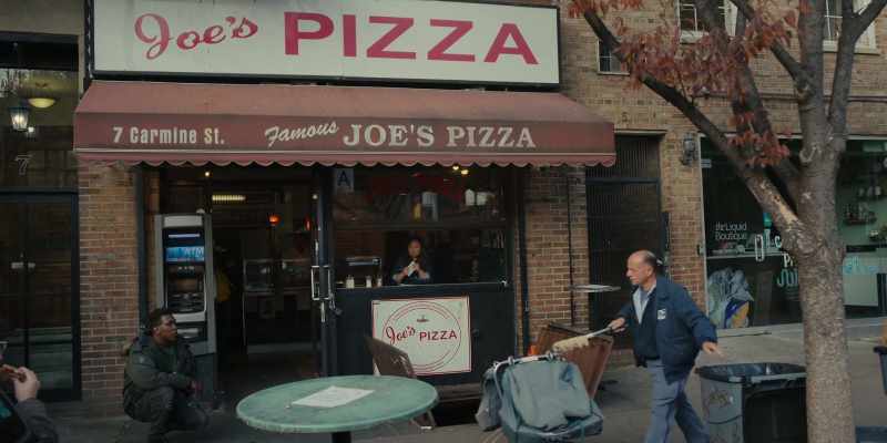 I'm standing on this street corner, eating