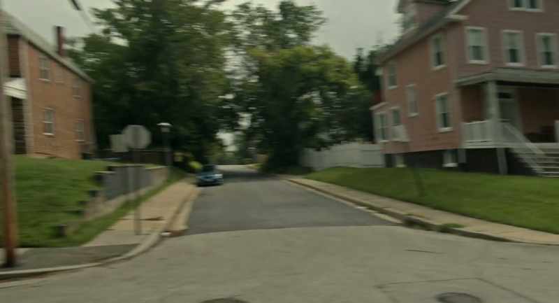 Immediately, a short, White bulldog-looking man jumps out